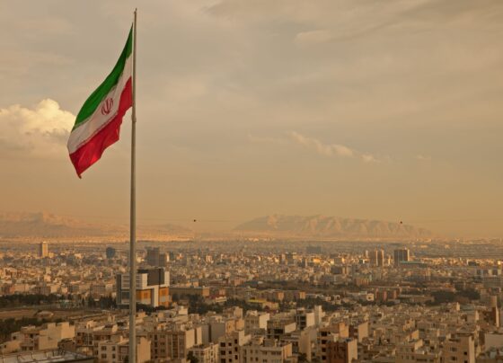 Iran Flag flying over city