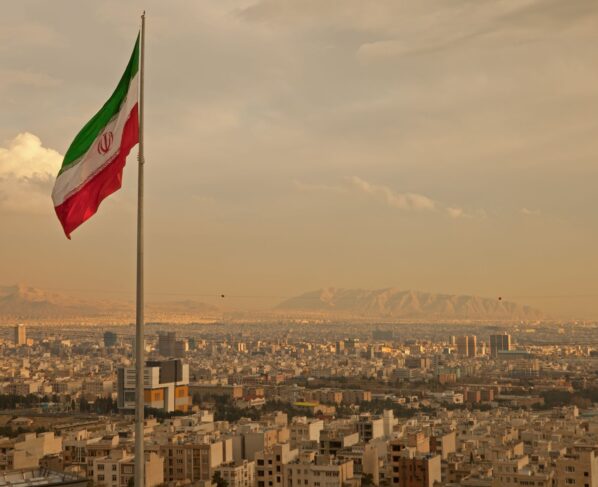 Iran Flag flying over city