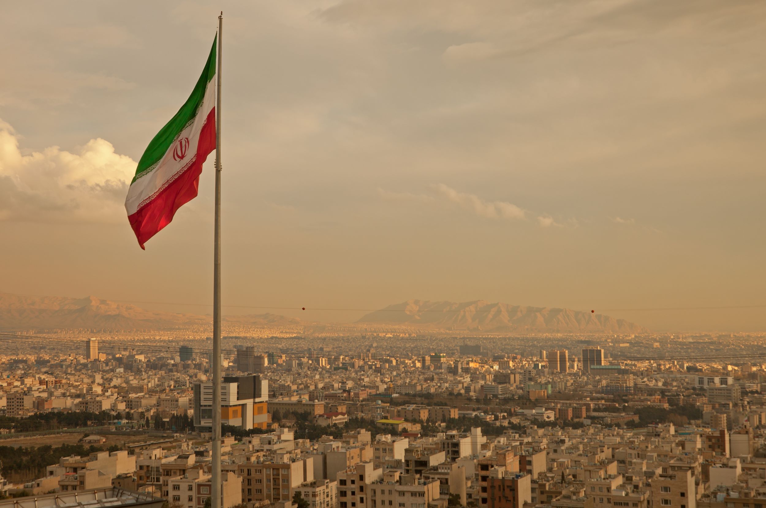 Iran Flag flying over city